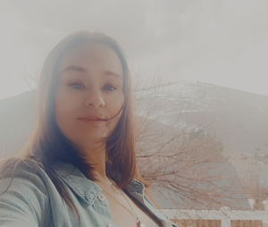 Misty Rodrigue with white foggy mountain background