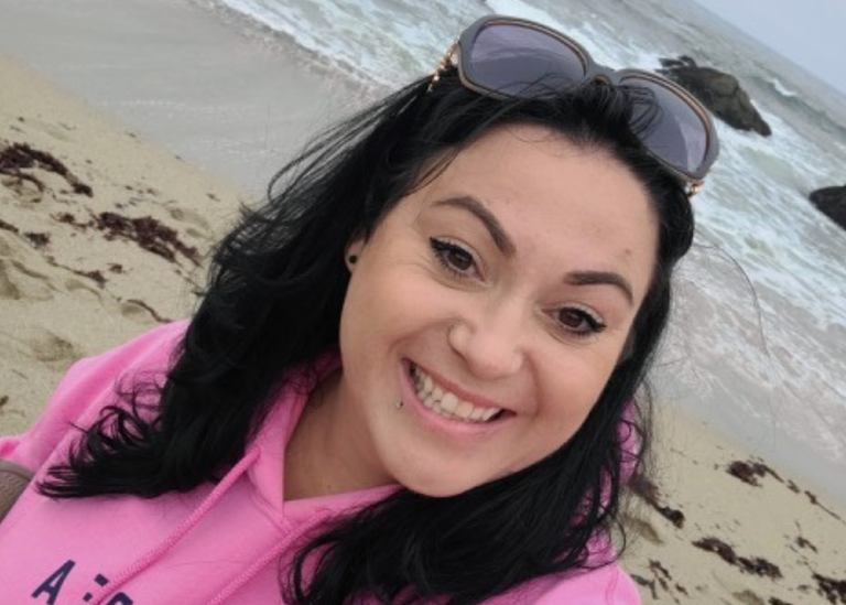 empowerment center graduate laura diaz headshot on the beach