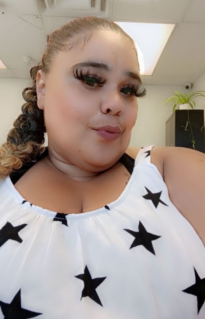 Nicole Hulihee wearing white shirt with blue stars